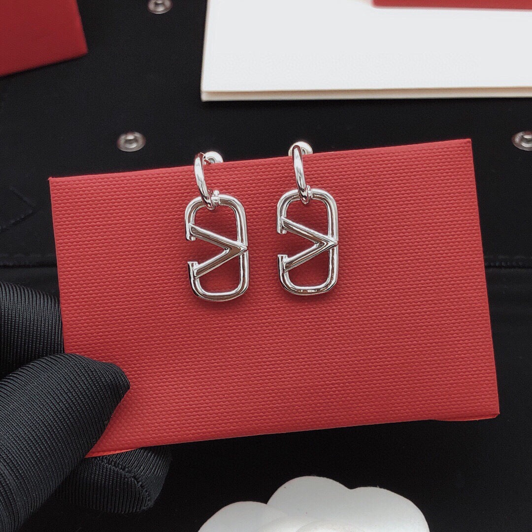 Martin Graham drop earrings in polished metal-tone – front view