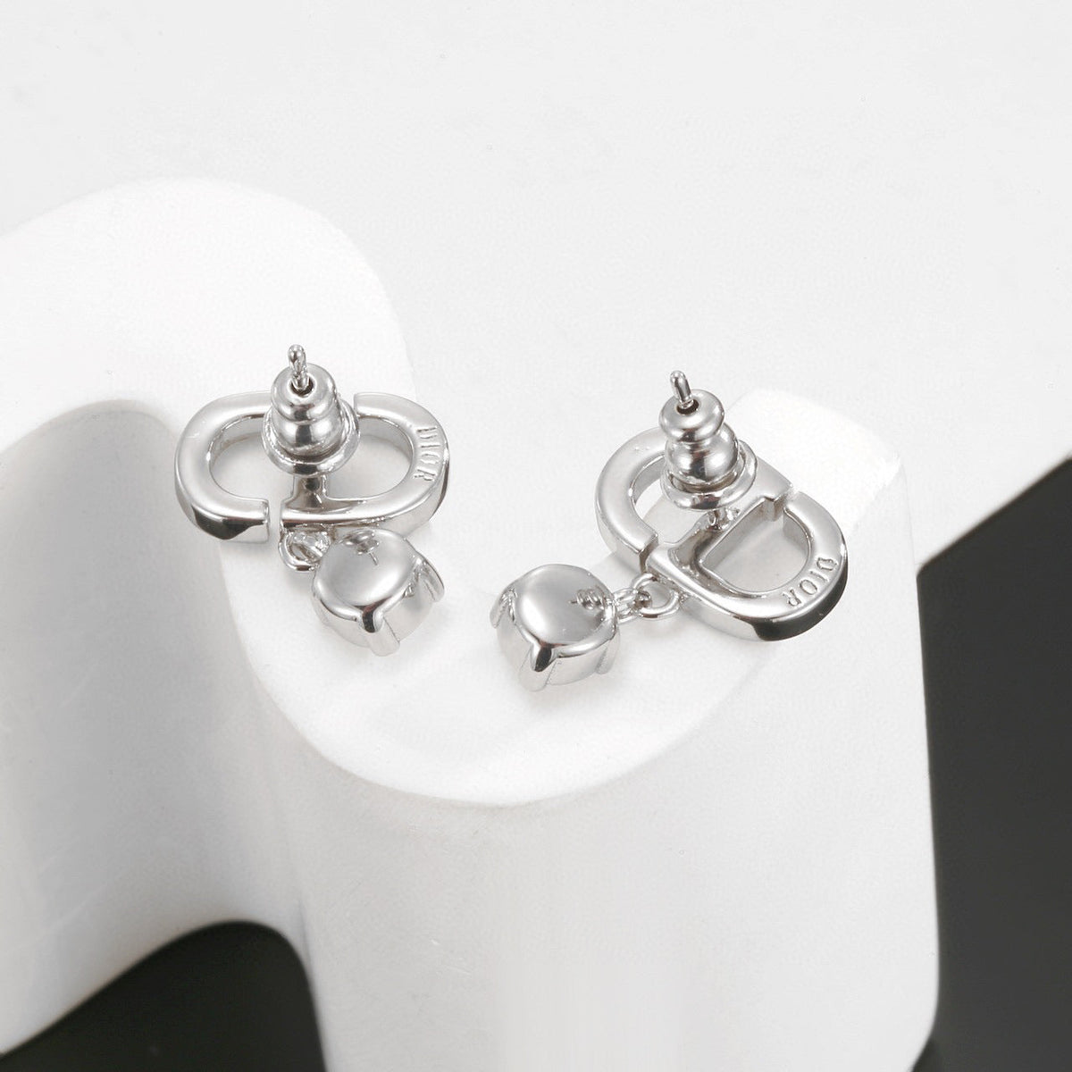 Martin Graham stud earrings in polished metal-tone – front view