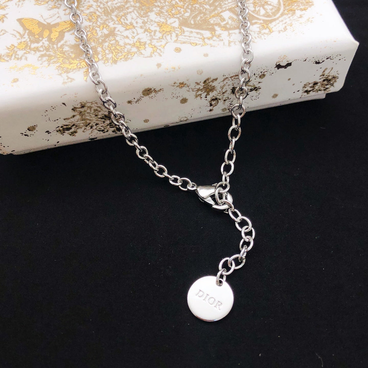 Martin Graham pendant necklace in polished metal-tone – front view