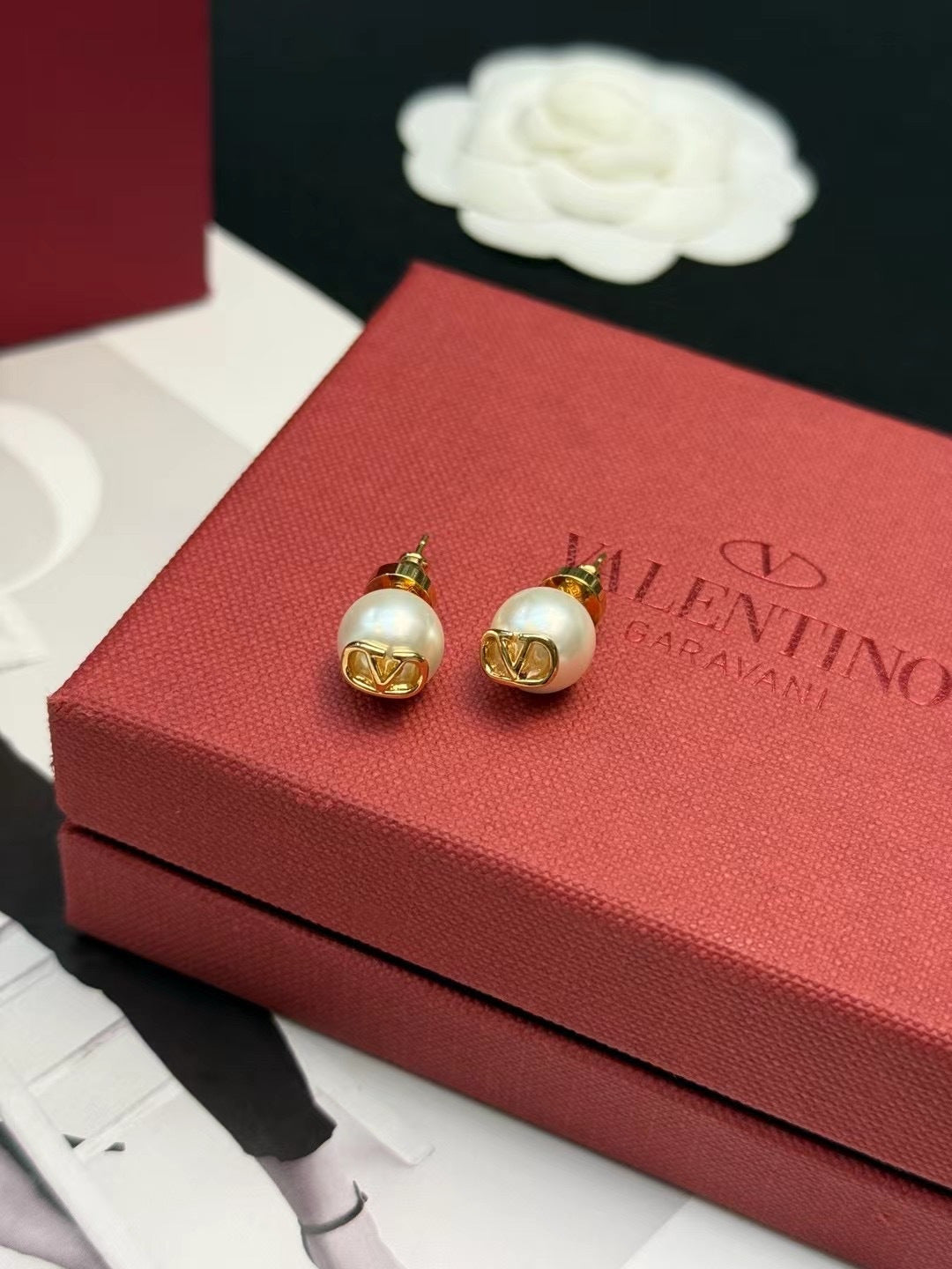 Martin Graham stud earrings in polished metal-tone – front view