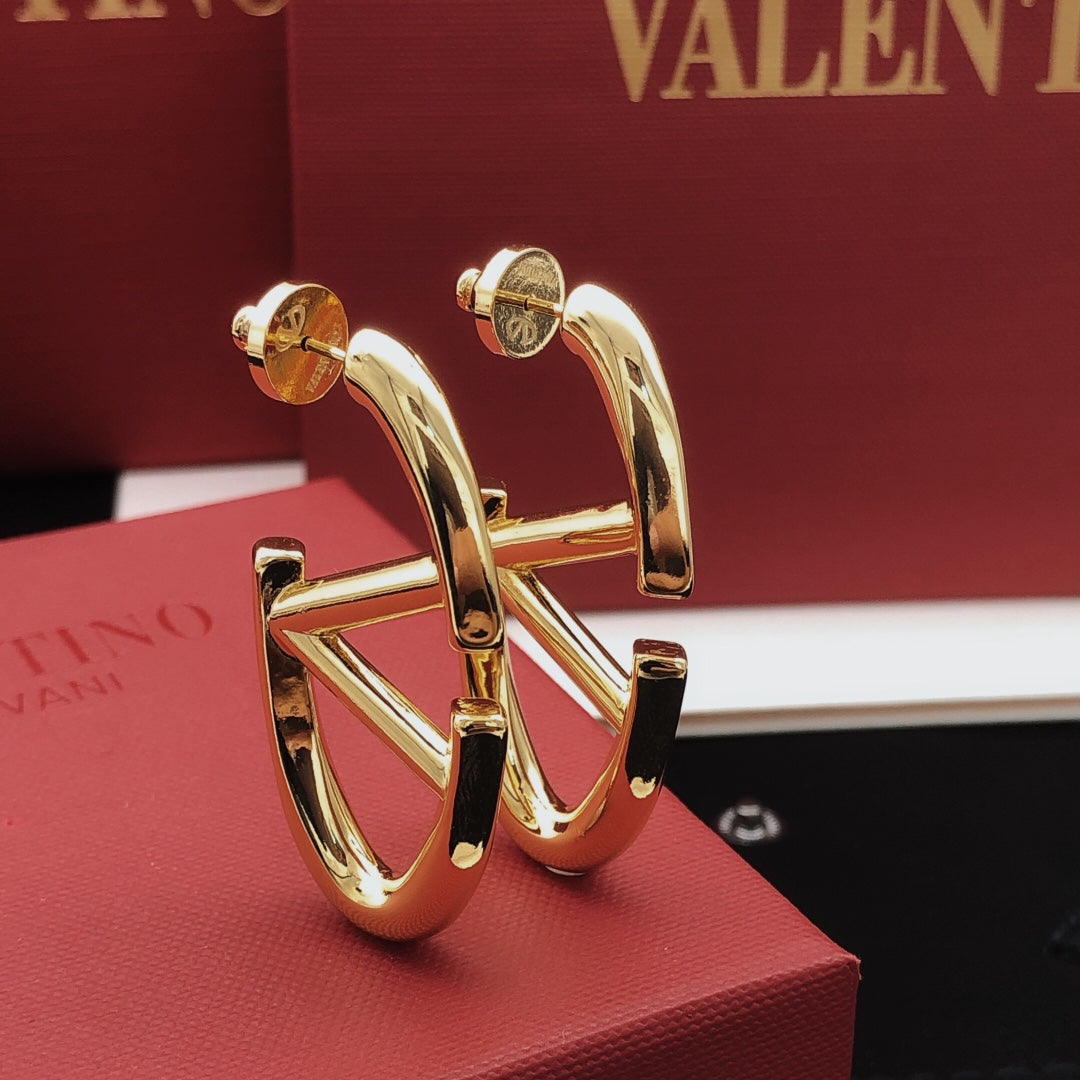 Martin Graham drop earrings in polished metal-tone – front view