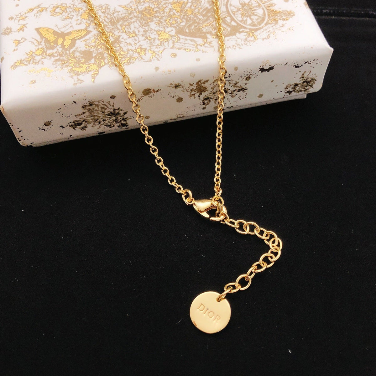 Martin Graham pendant necklace in polished metal-tone – front view