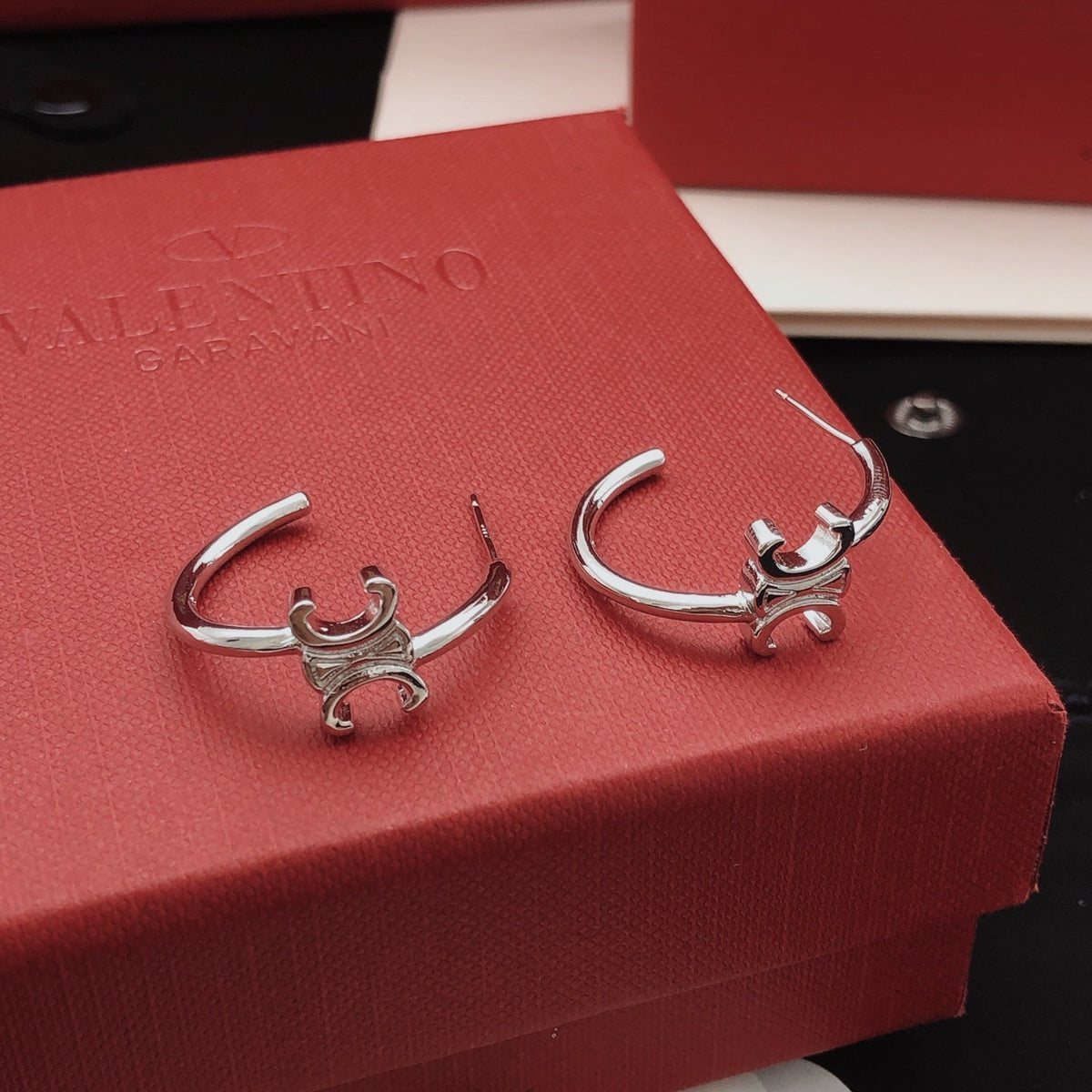 Martin Graham drop earrings in polished metal-tone – front view