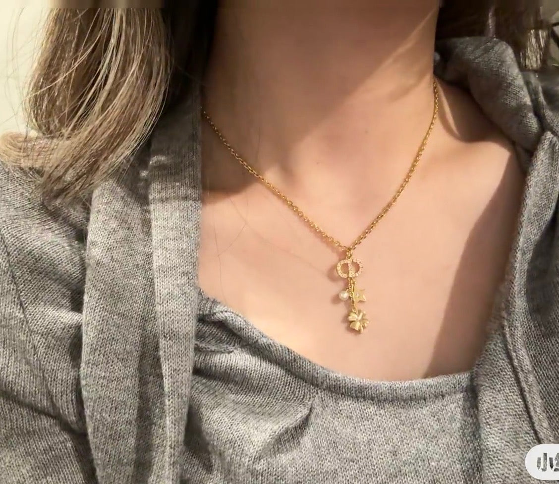 Martin Graham pendant necklace in polished metal-tone – front view