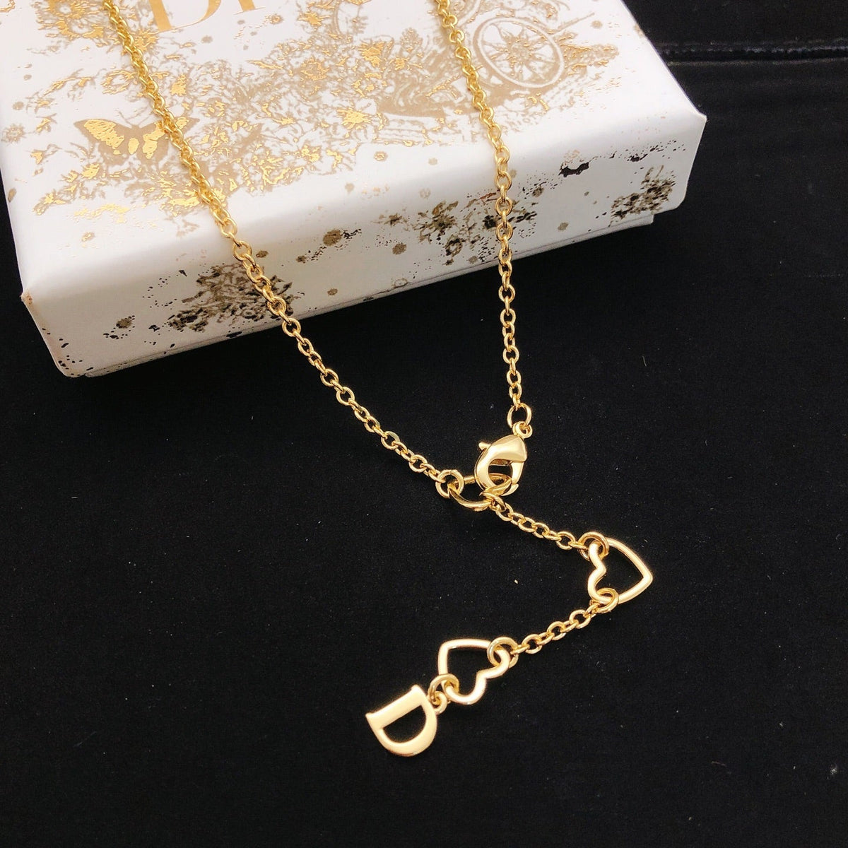 Martin Graham pendant necklace in polished metal-tone – front view