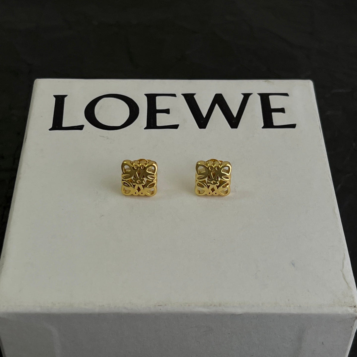 Martin Graham stud earrings in polished metal-tone – front view