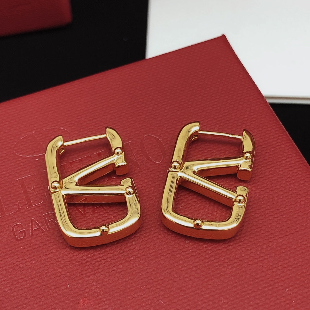 Martin Graham drop earrings in polished metal-tone – front view