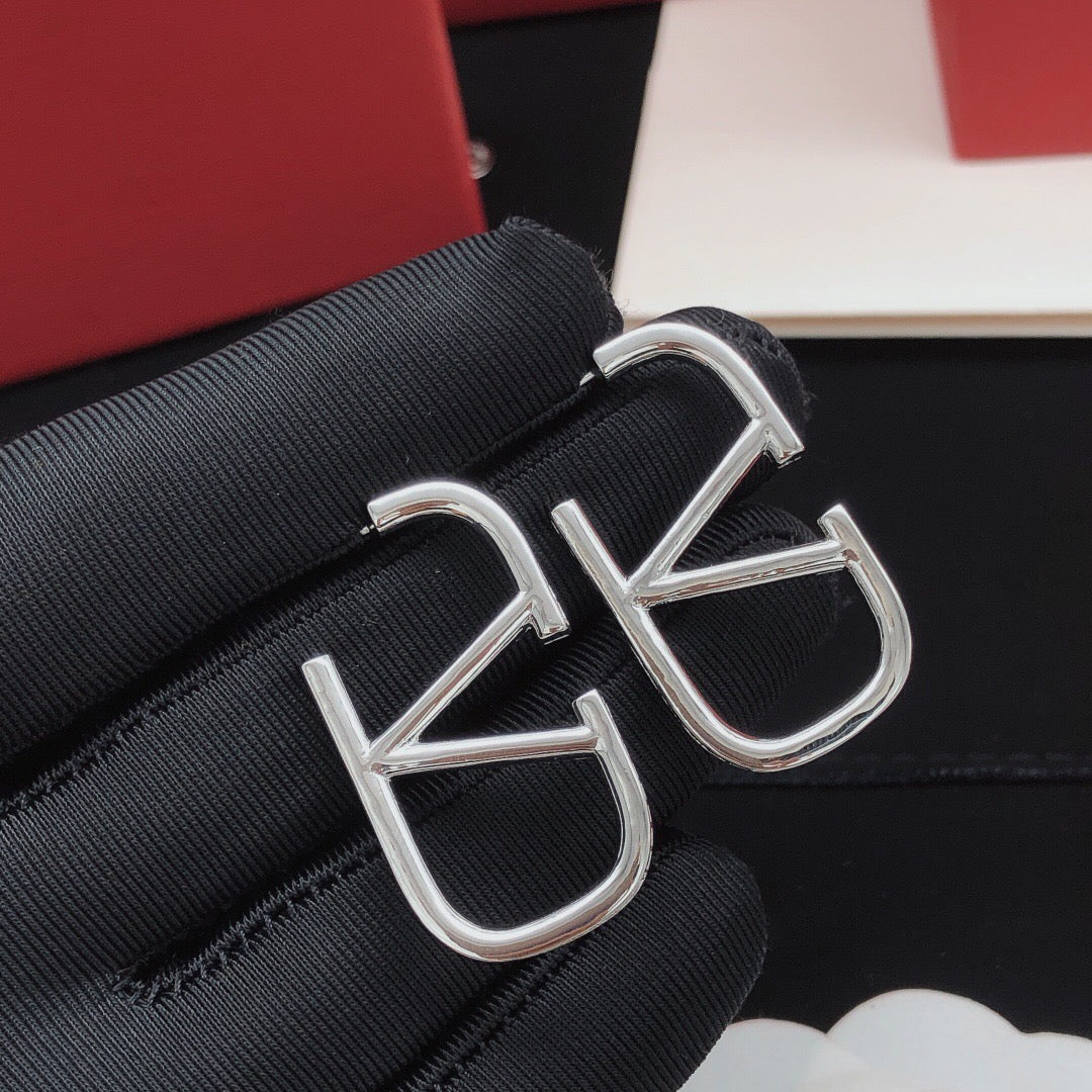 Martin Graham stud earrings in polished metal-tone – front view