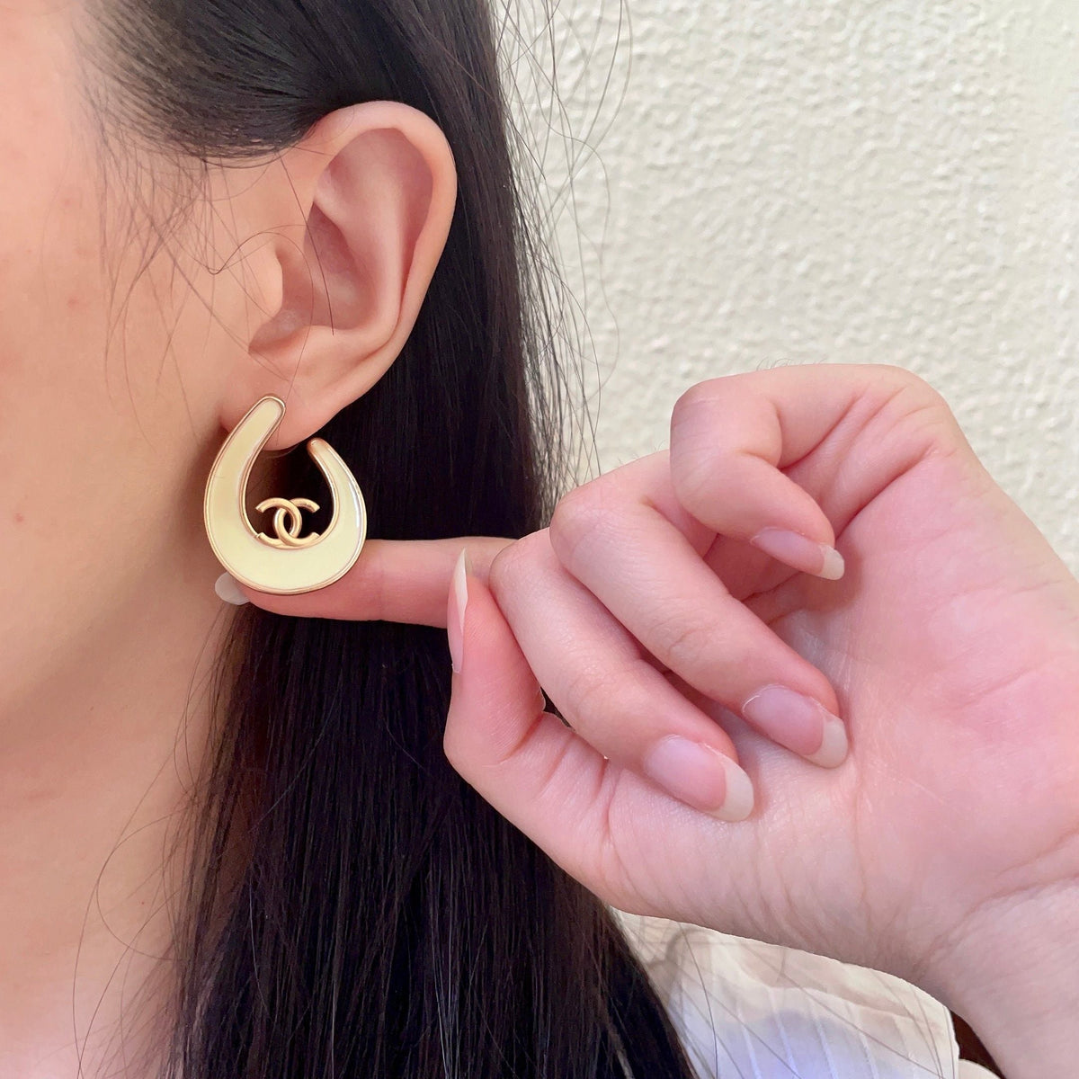 Martin Graham stud earrings in polished metal-tone – front product view