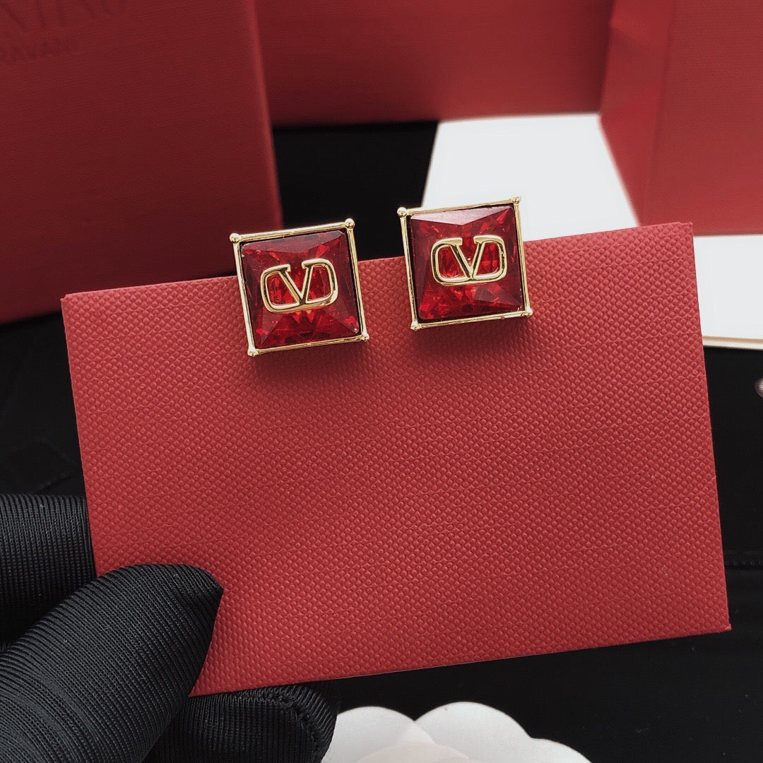 Martin Graham stud earrings in polished metal-tone – front view
