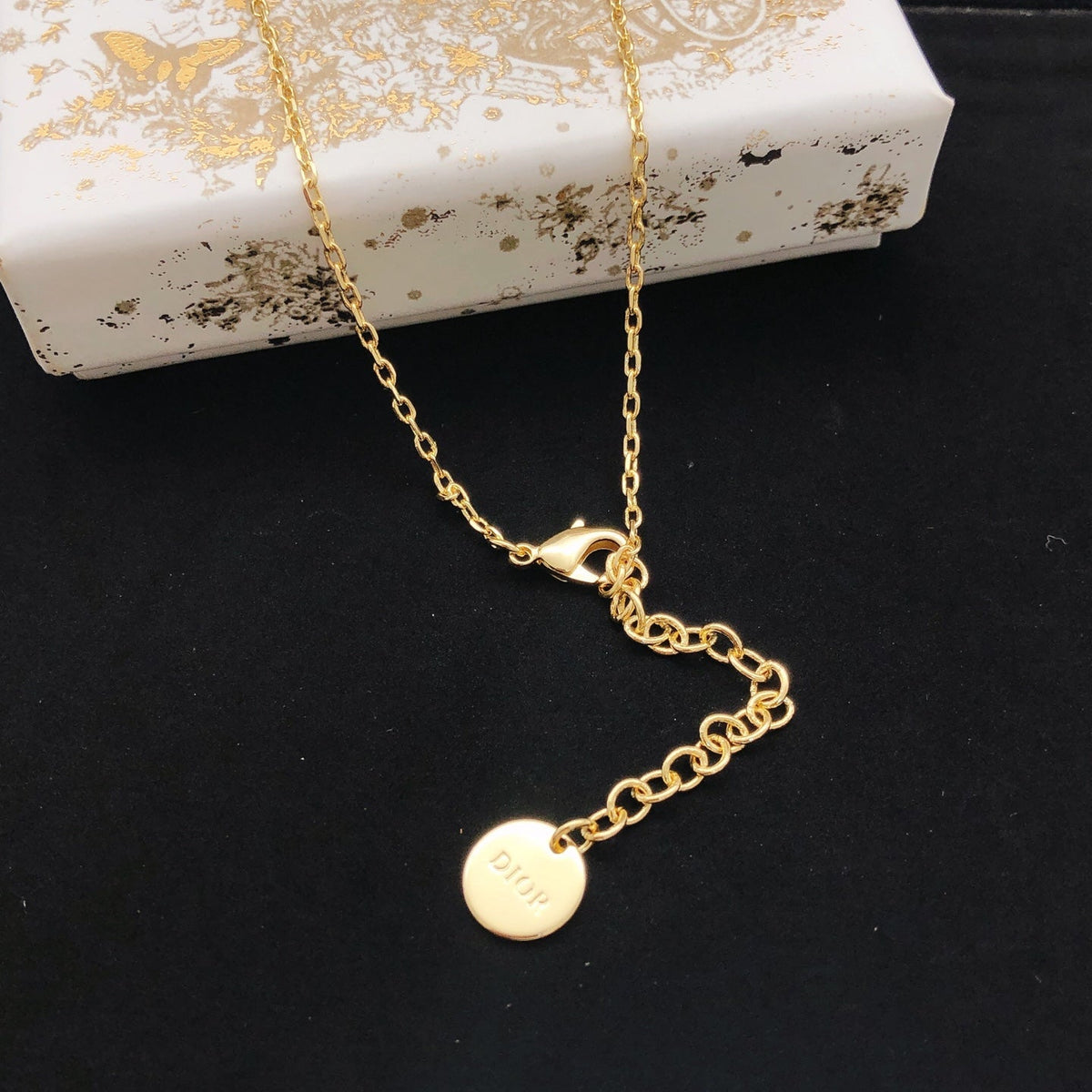 Martin Graham pendant necklace in polished metal-tone – front view