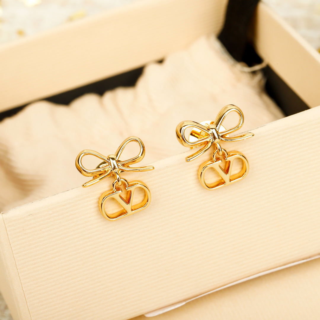 Martin Graham earrings in polished metal-tone – front view