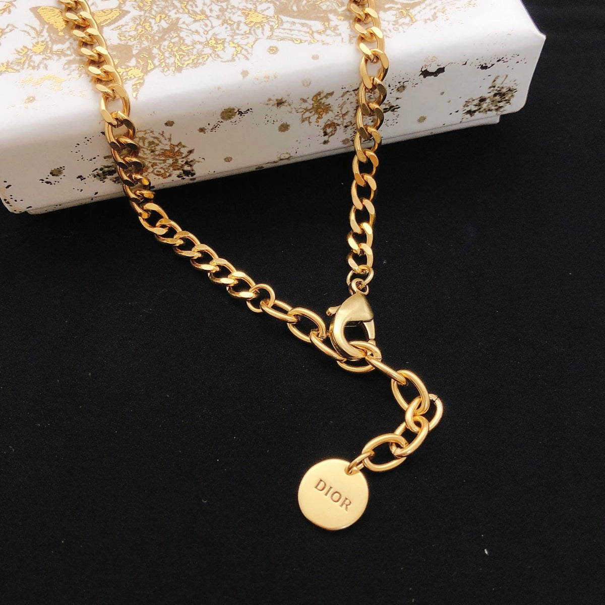 Martin Graham pendant necklace in polished metal-tone – front view