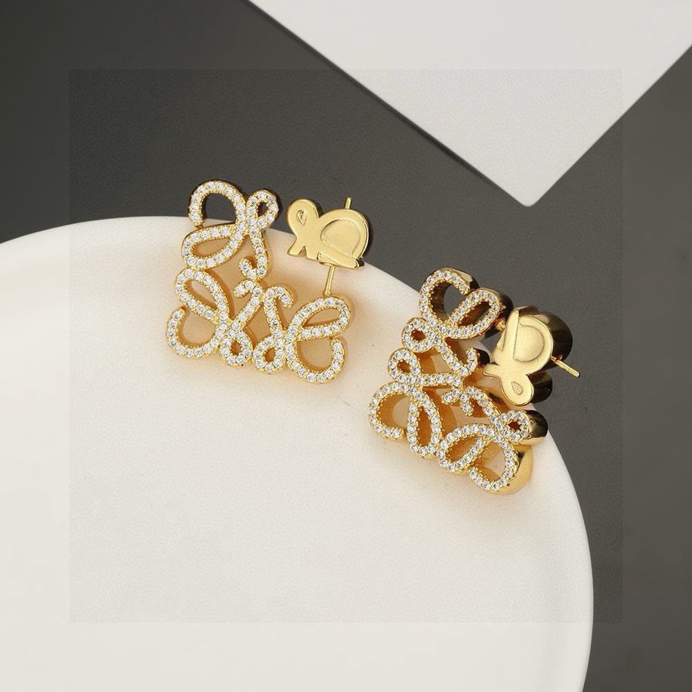 Martin Graham stud earrings in polished metal-tone – front view