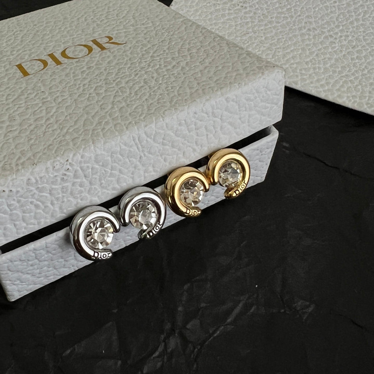 Martin Graham stud earrings in polished metal-tone – front view