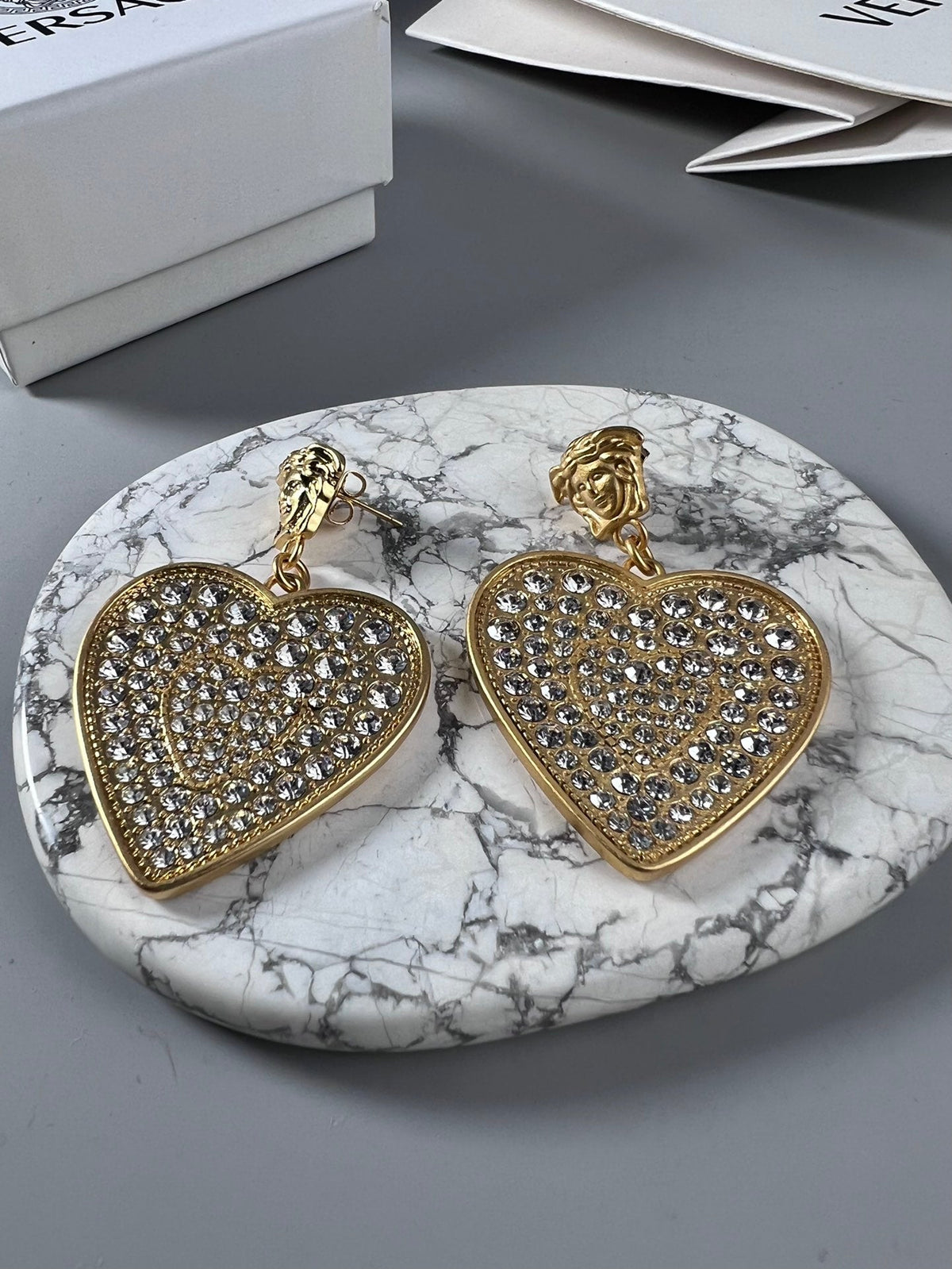 Martin Graham stud earrings in polished metal-tone – front product view