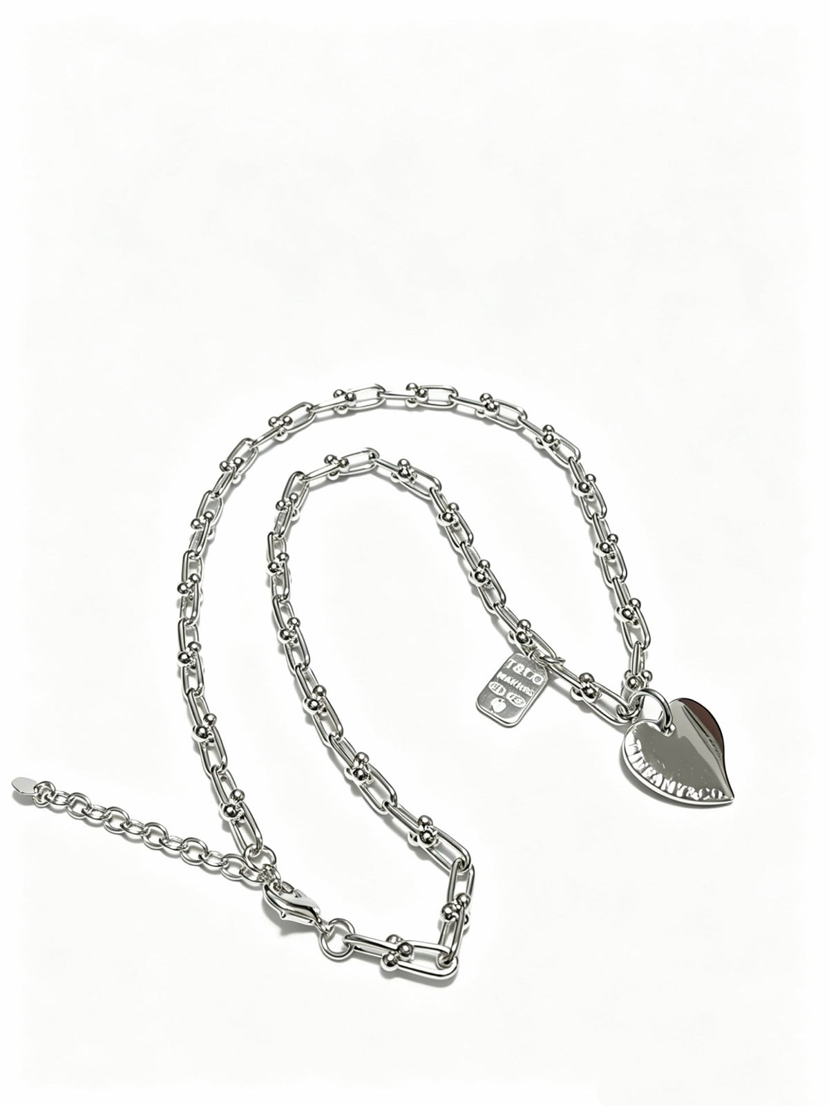 Martin Graham pendant necklace in polished metal-tone – detail view