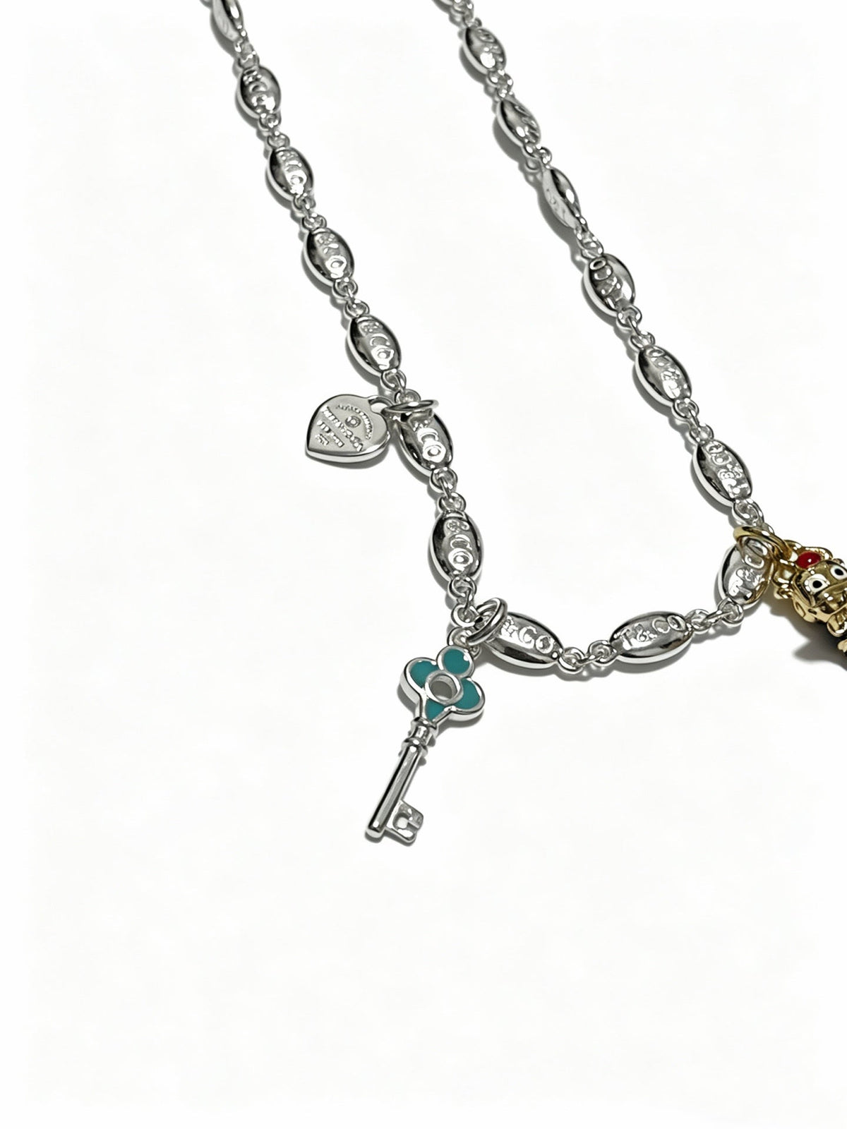 Martin Graham pendant necklace in polished metal-tone – detail view