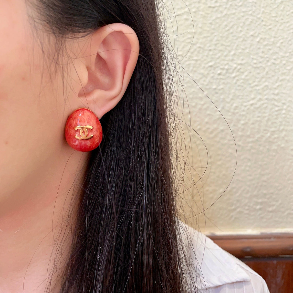 Martin Graham stud earrings in polished metal-tone – detail view