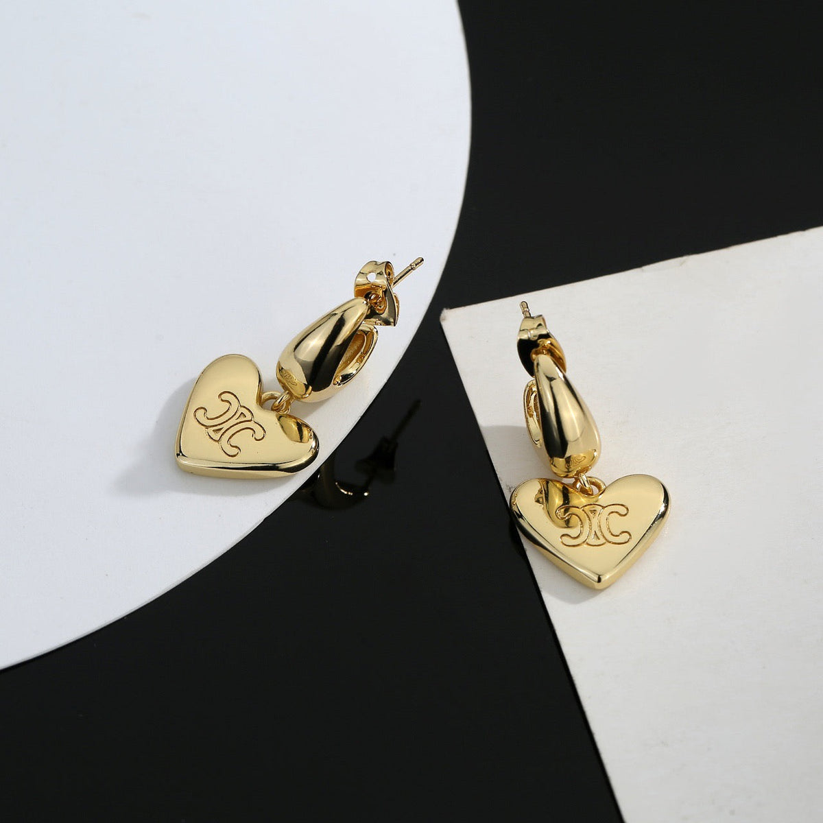 Martin Graham stud earrings in polished metal-tone – detail view