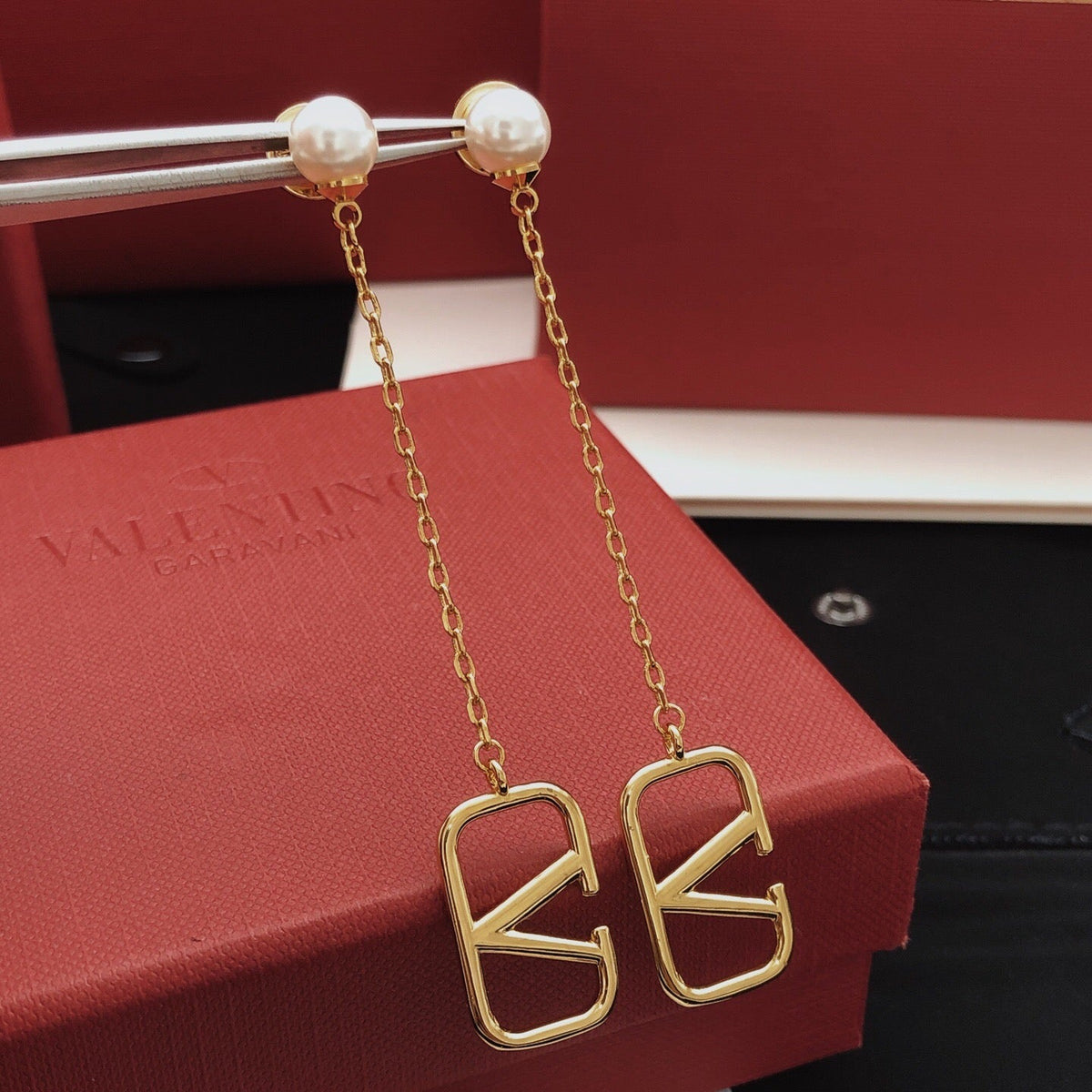 Martin Graham stud earrings in polished metal-tone – detail view