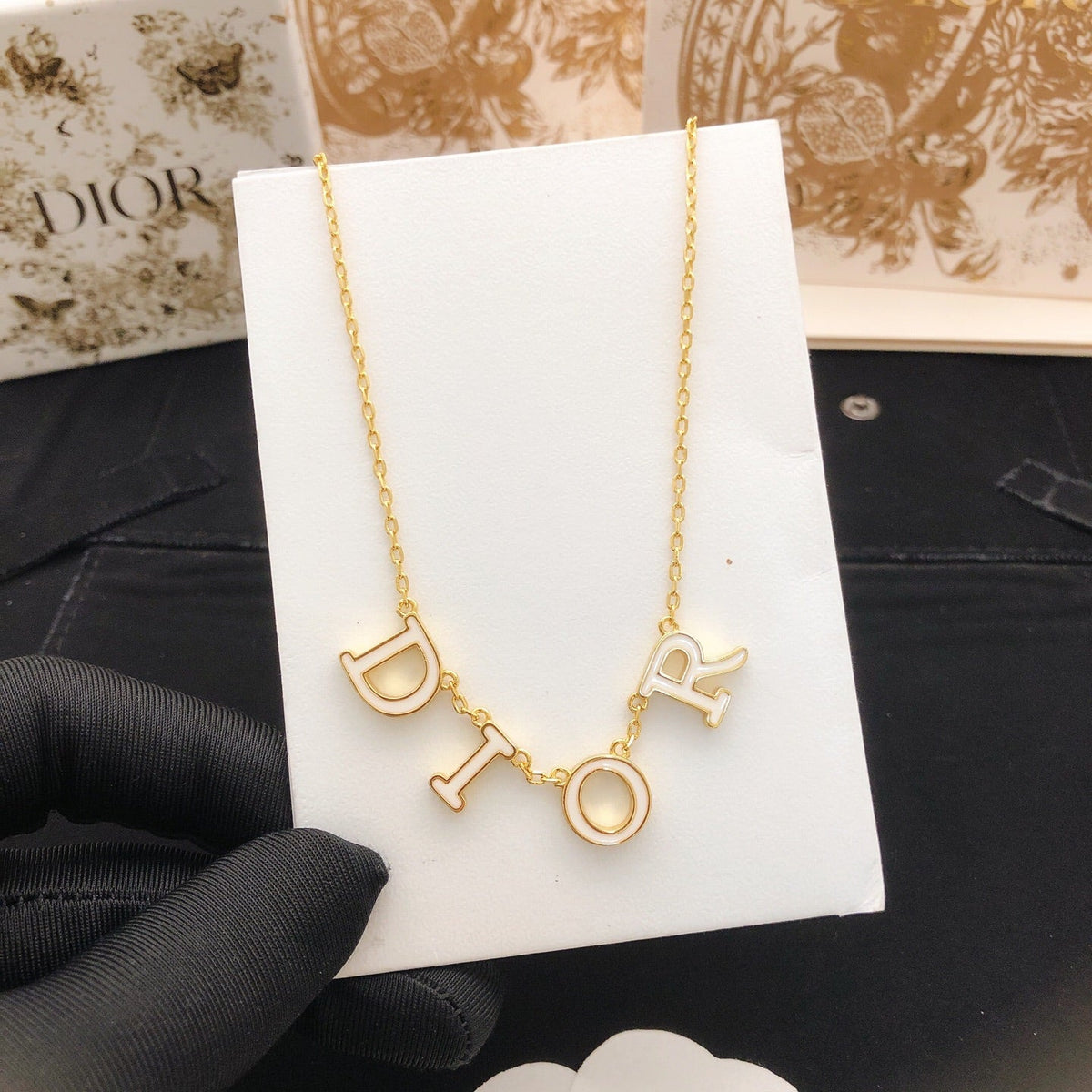 Martin Graham pendant necklace in polished metal-tone – detail view