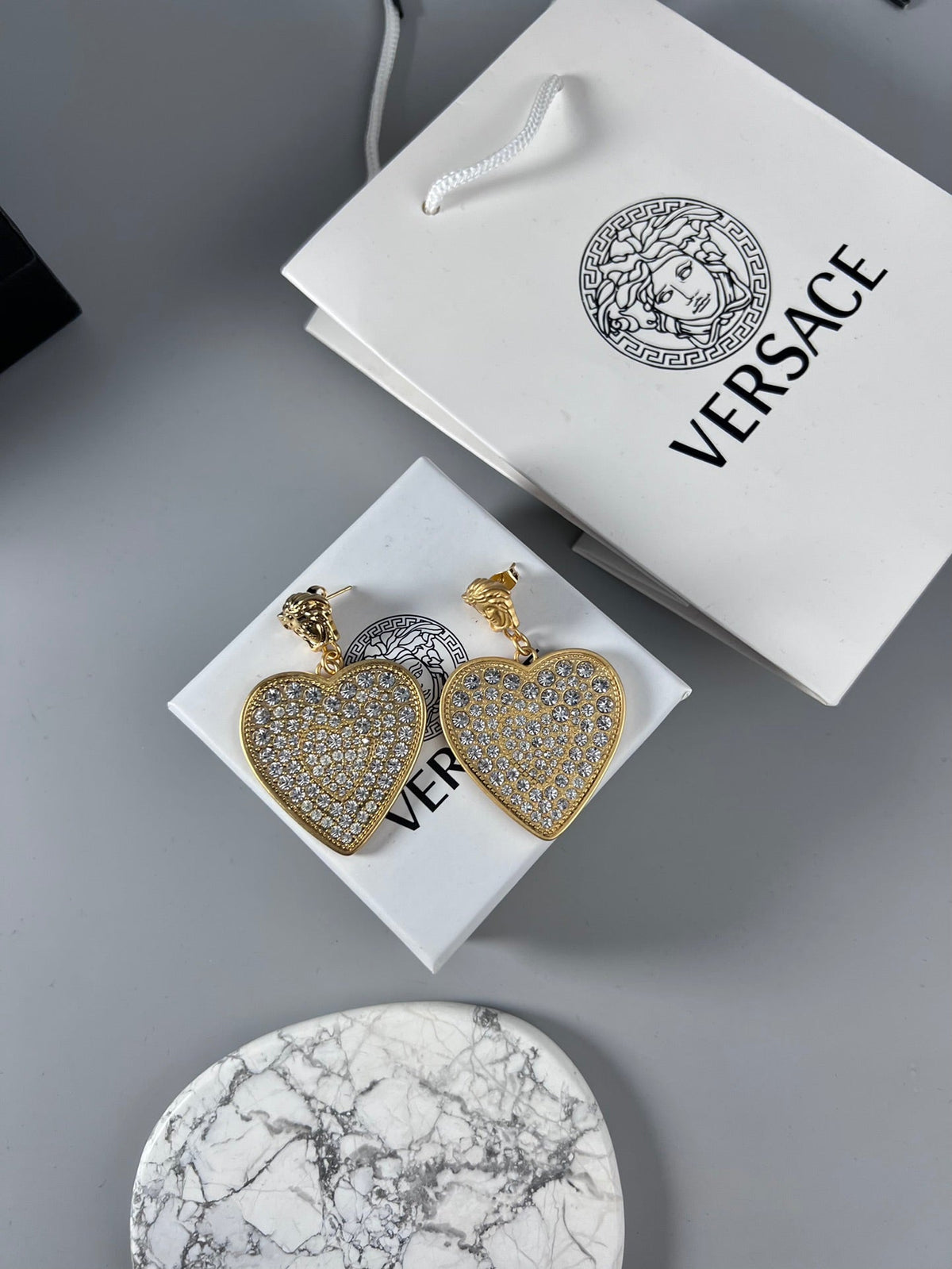 Martin Graham stud earrings in polished metal-tone – detail view