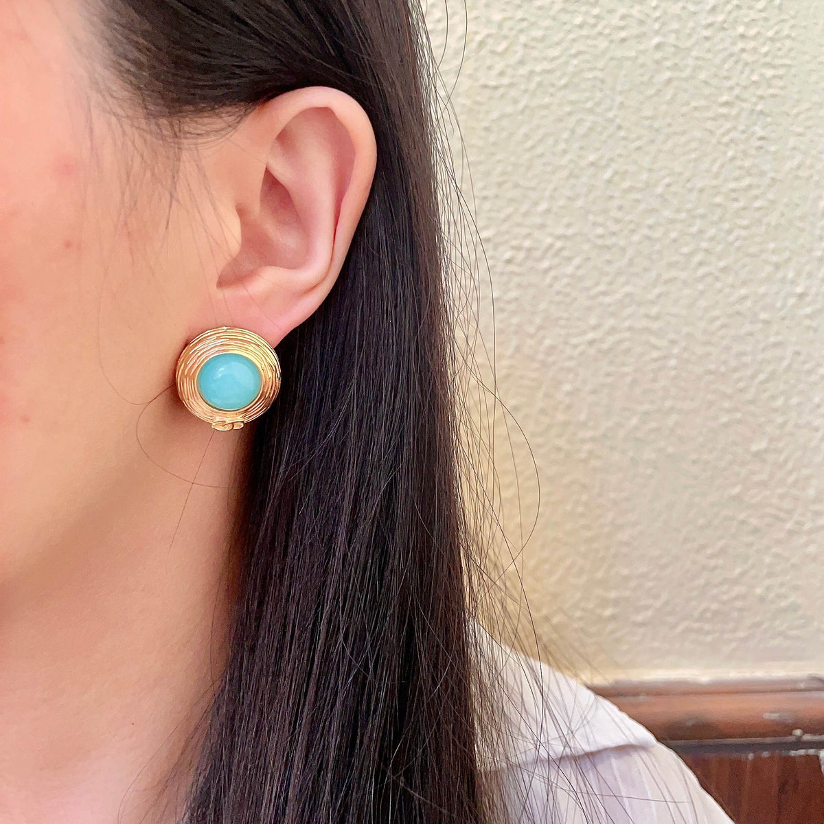 Martin Graham stud earrings in polished metal-tone – detail view