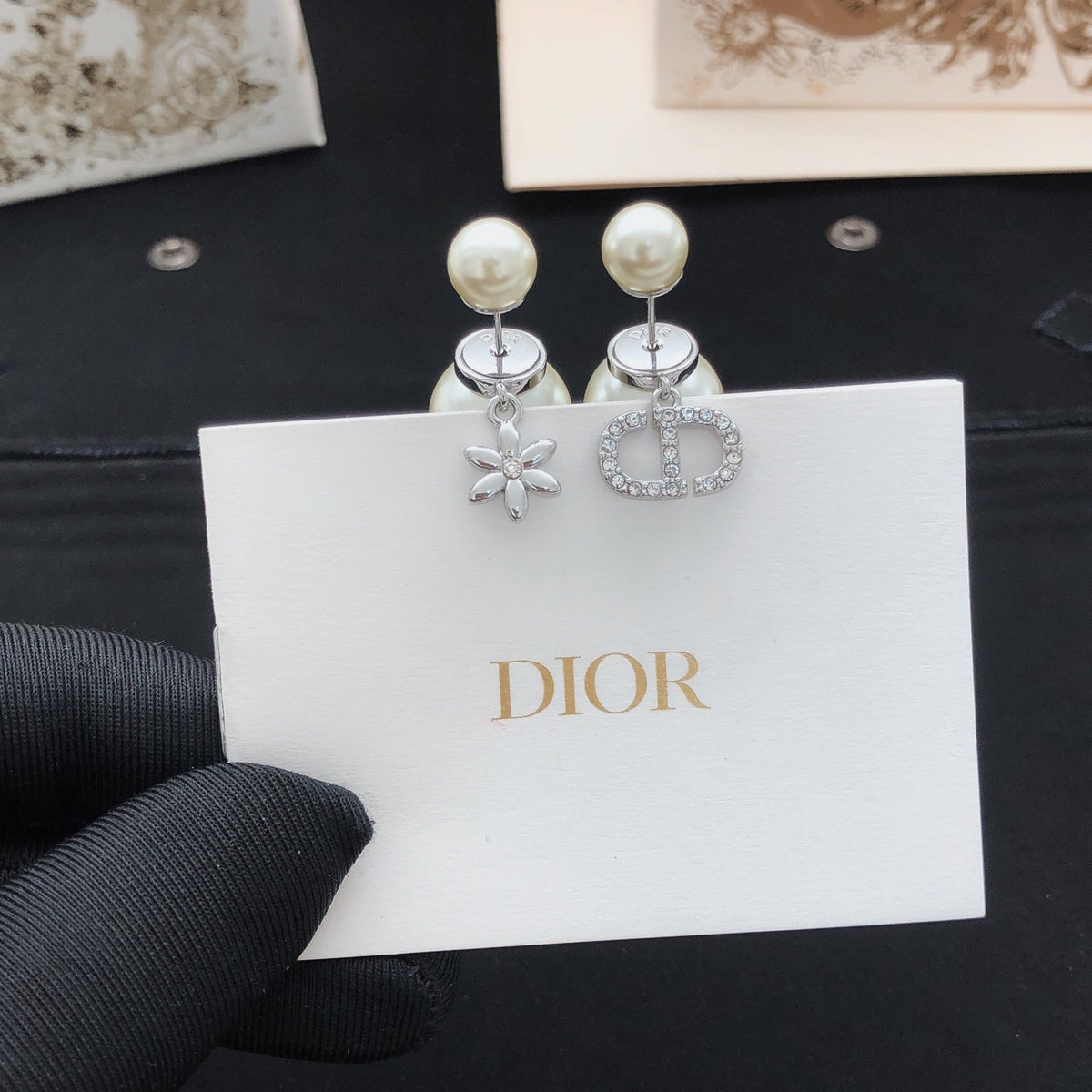 Martin Graham stud earrings in polished metal-tone – detail view