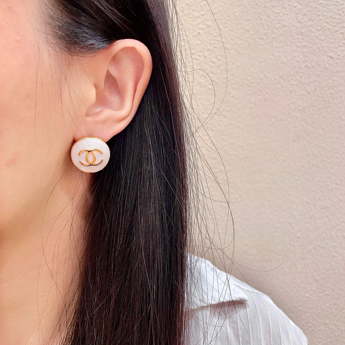 Martin Graham stud earrings in polished metal-tone – detail view