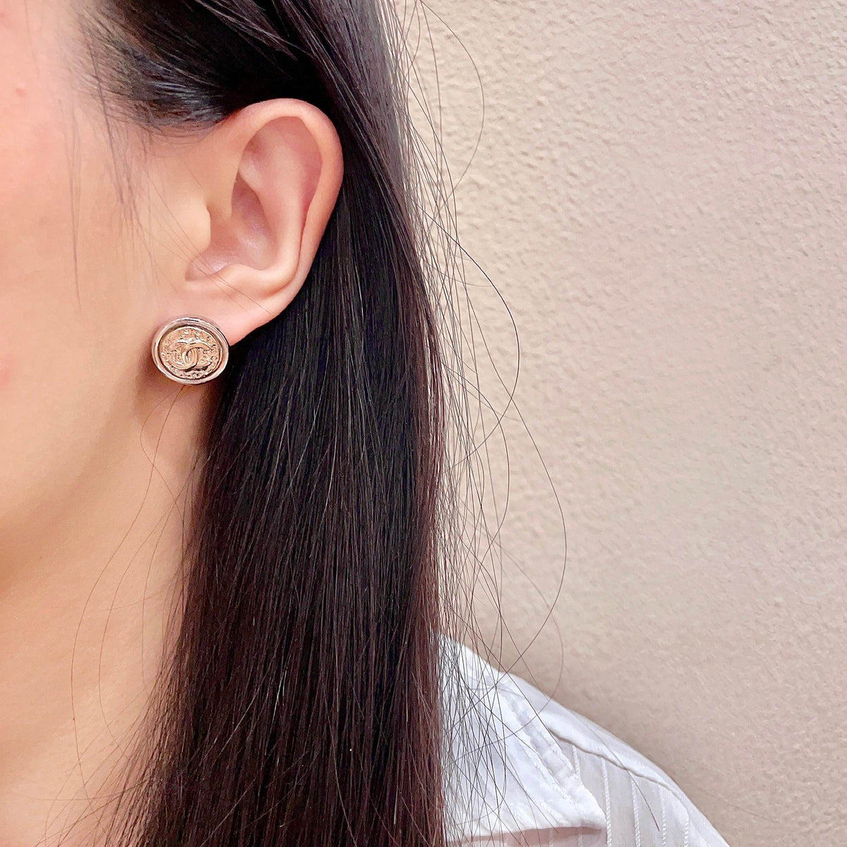 Martin Graham stud earrings in polished metal-tone – detail view