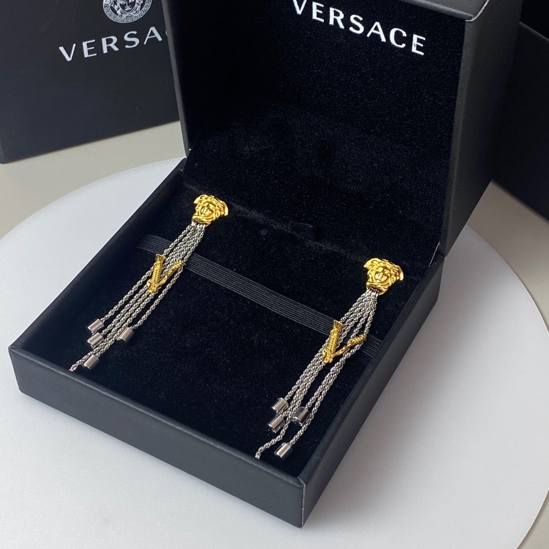 Martin Graham stud earrings in polished metal-tone – detail view