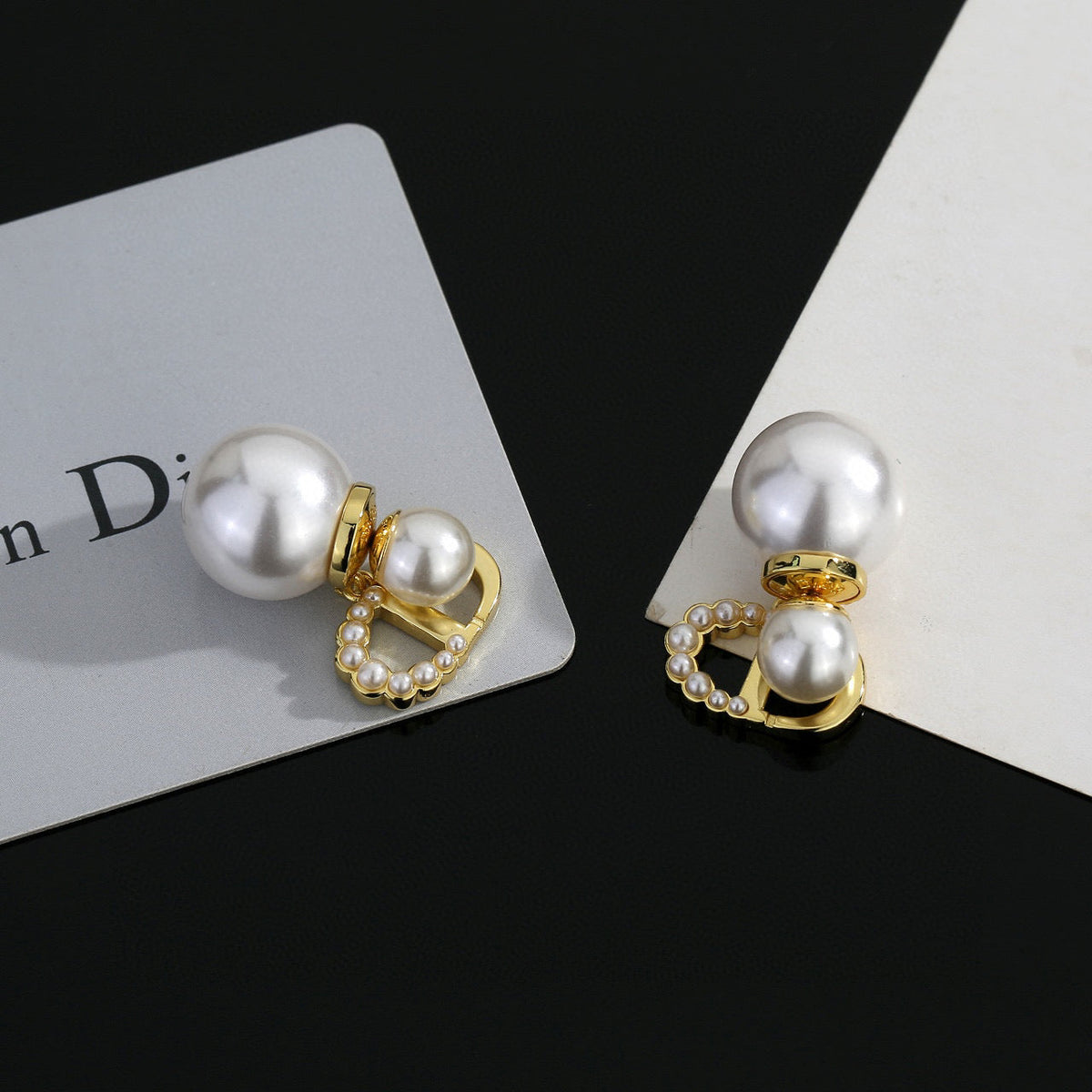 Martin Graham stud earrings in polished metal-tone – detail view