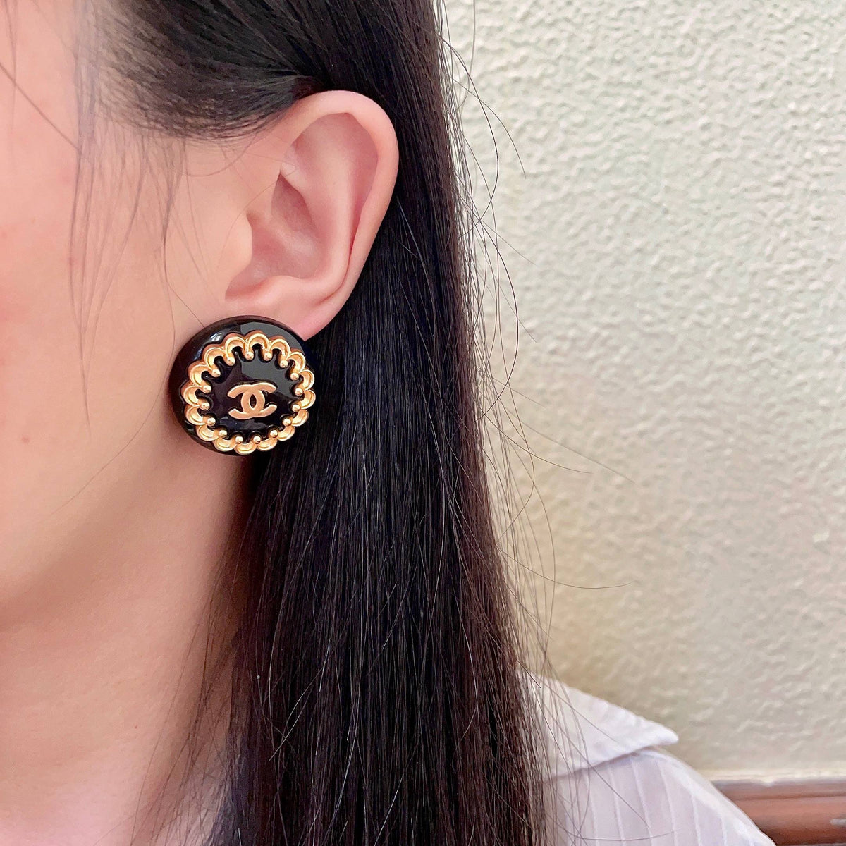 Martin Graham stud earrings in polished metal-tone – detail view