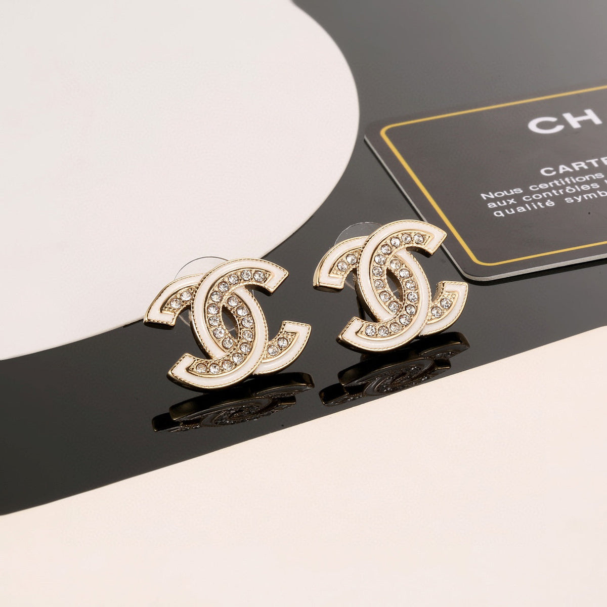 Martin Graham stud earrings in polished metal-tone – detail view