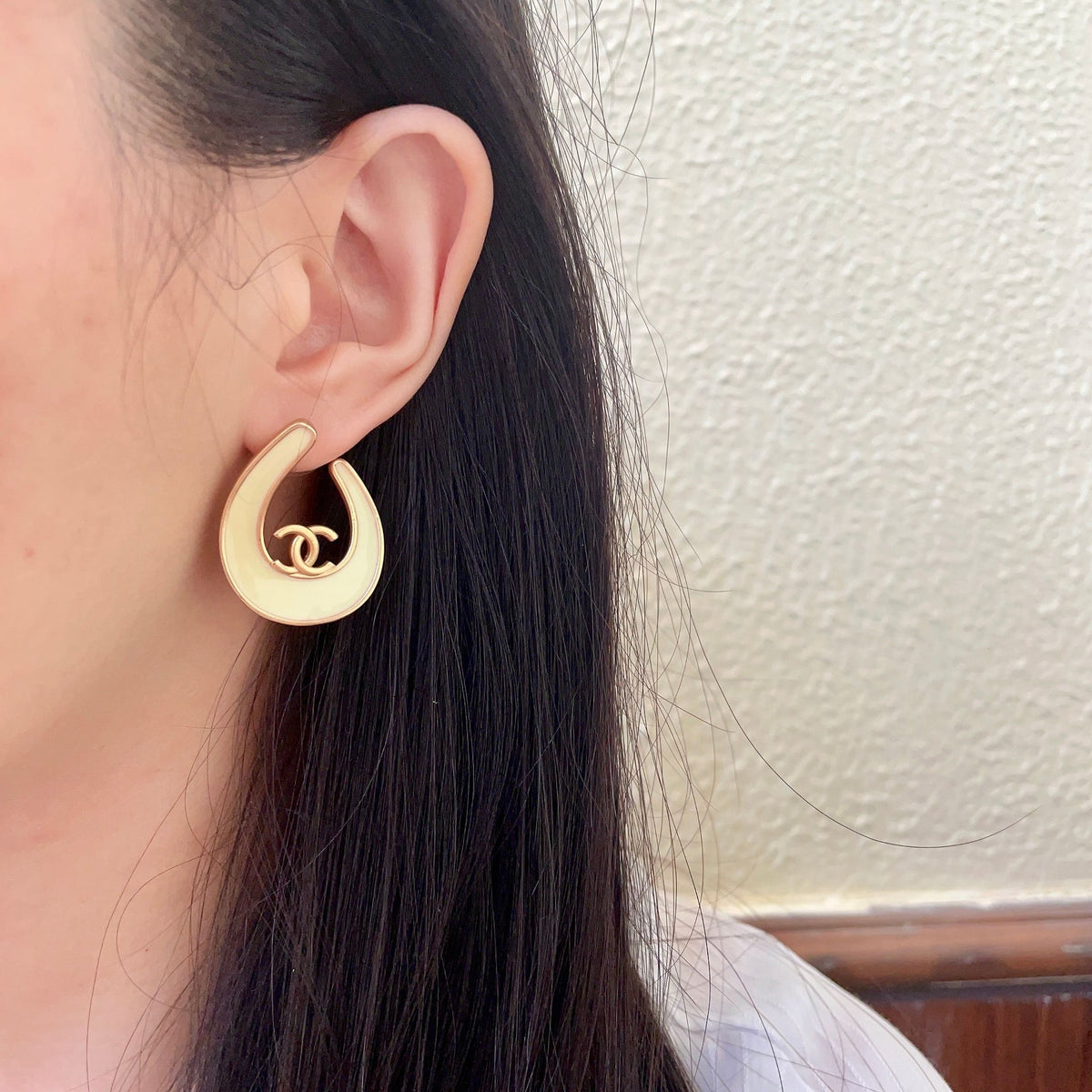 Martin Graham stud earrings in polished metal-tone – detail view