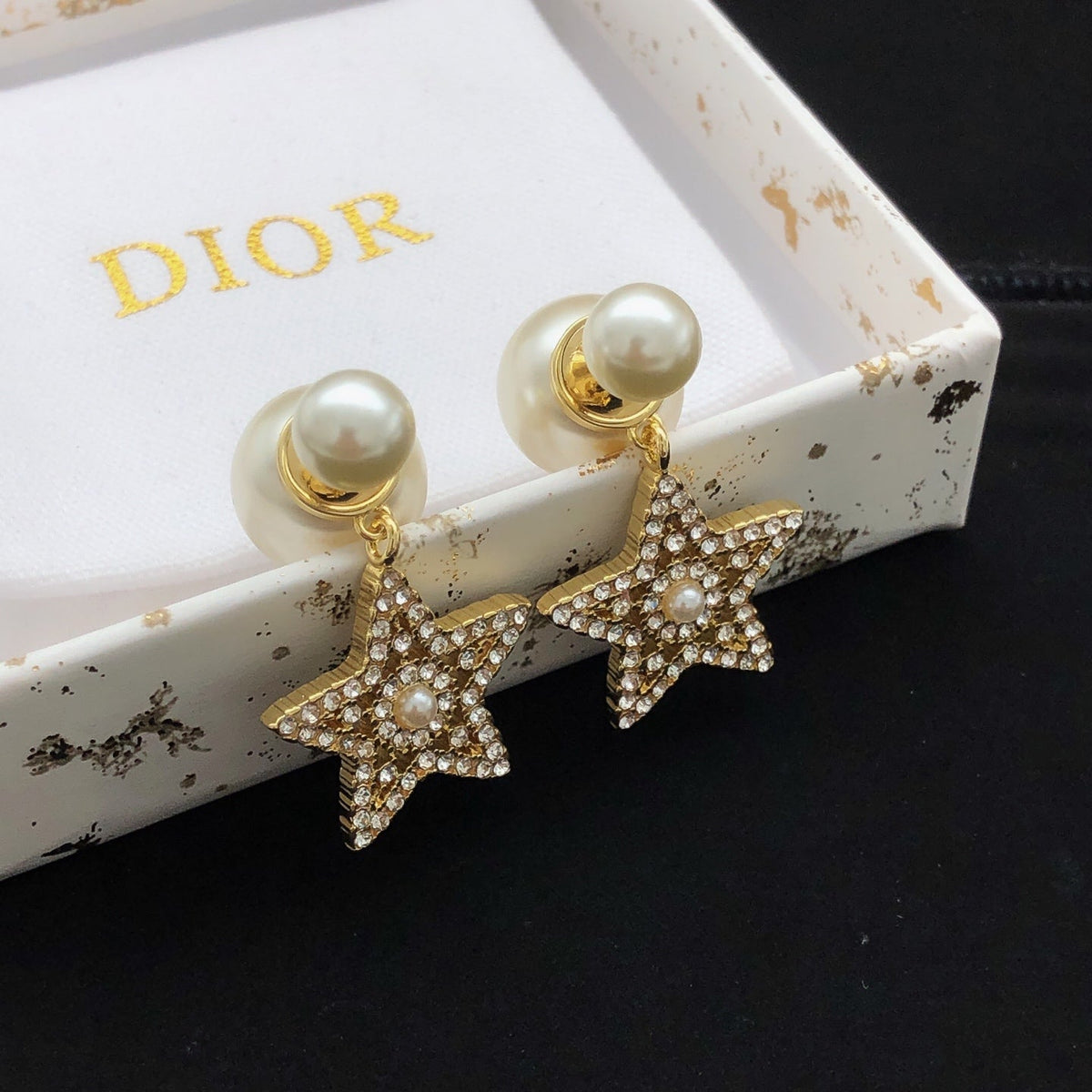 Martin Graham stud earrings in polished metal-tone – detail view
