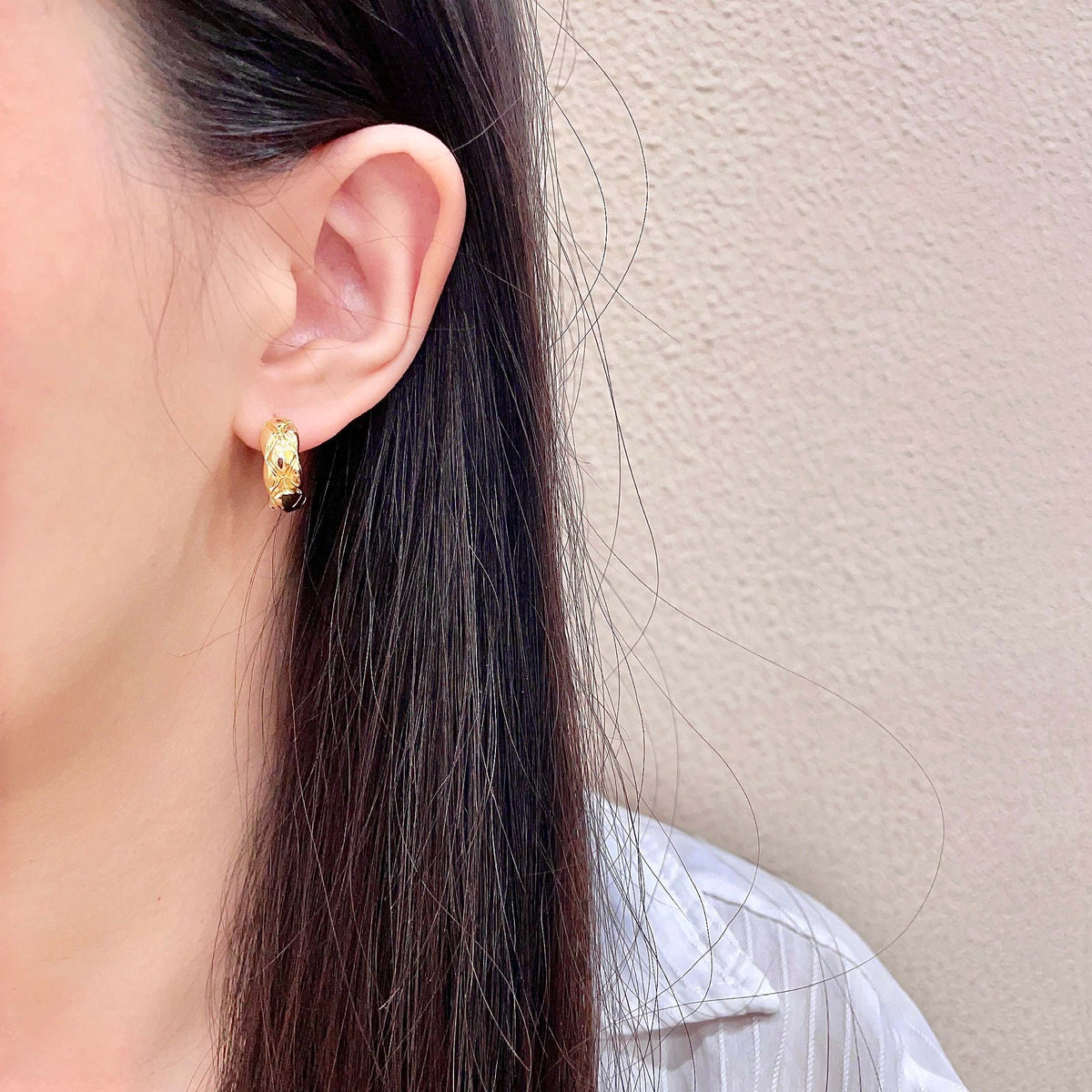 Martin Graham stud earrings in polished metal-tone – detail view