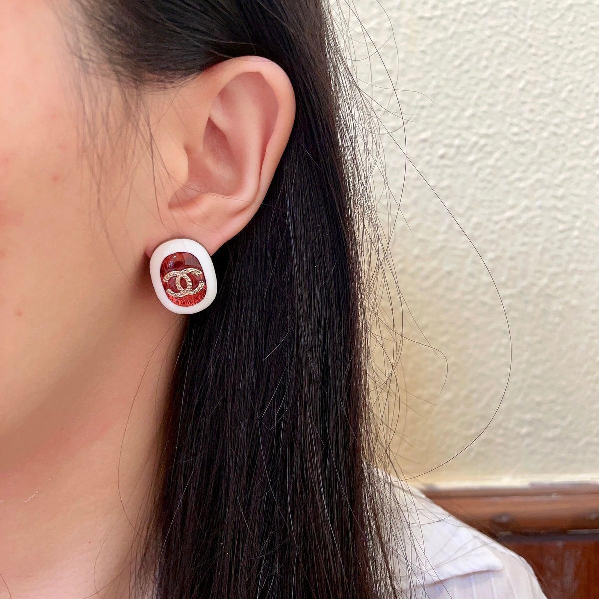 Martin Graham stud earrings in polished metal-tone – detail view