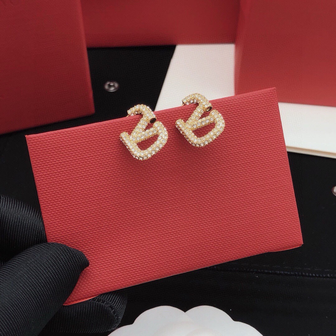 Martin Graham stud earrings in polished metal-tone – detail view