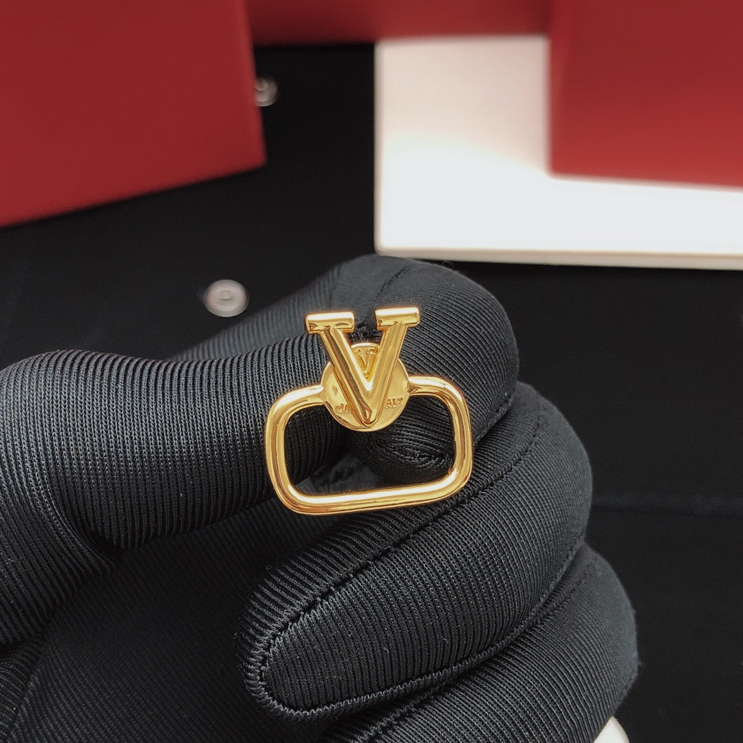 Martin Graham stud earrings in polished metal-tone – detail view