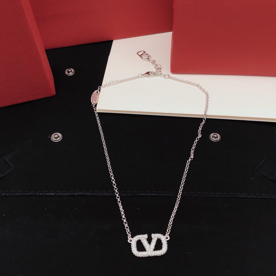 Martin Graham pendant necklace in polished metal-tone – detail view
