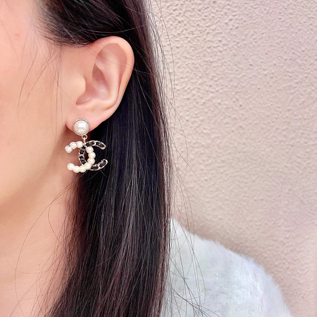 Martin Graham stud earrings in polished metal-tone – detail view