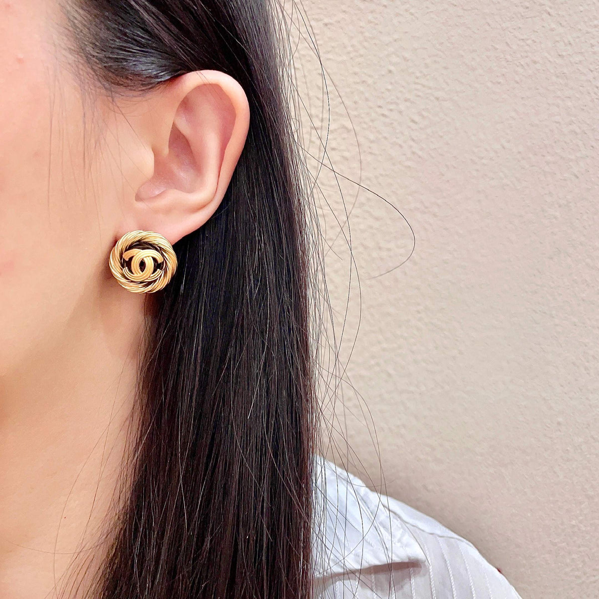 Martin Graham stud earrings in polished metal-tone – detail view