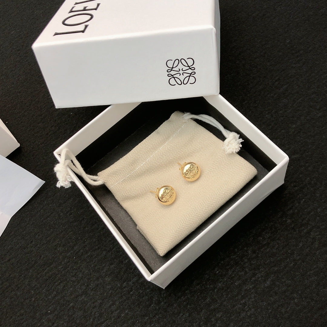 Martin Graham stud earrings in polished metal-tone – detail view