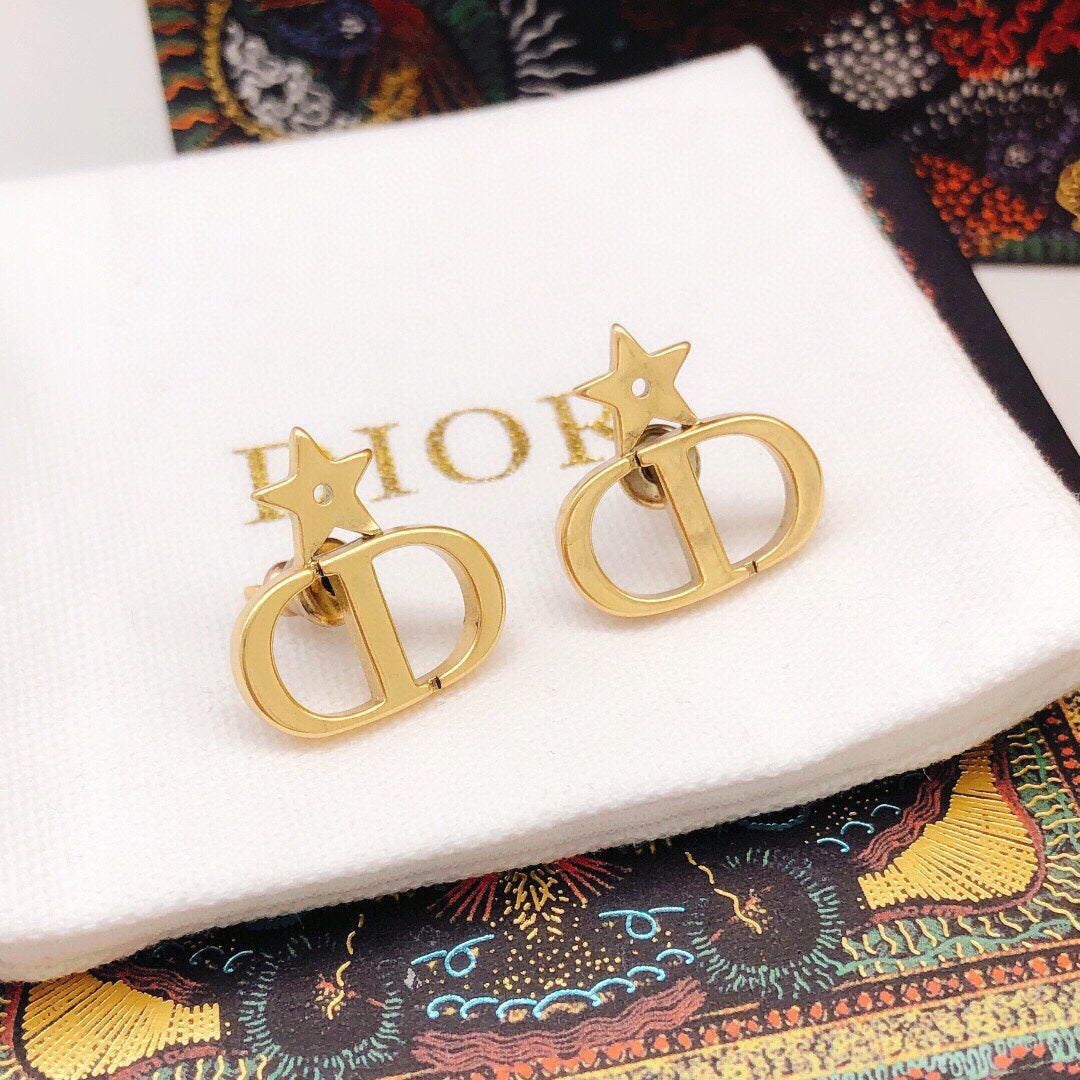 Martin Graham stud earrings in polished metal-tone – detail view
