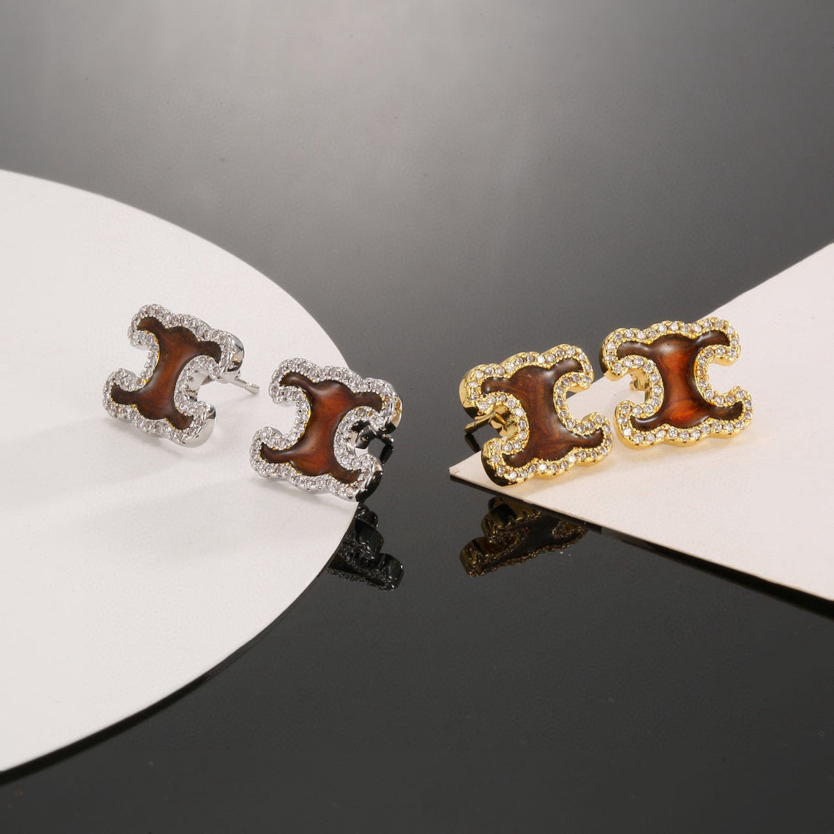 Martin Graham stud earrings in polished metal-tone – detail view