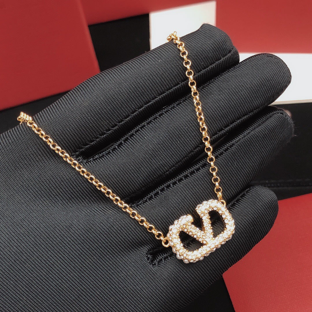 Martin Graham pendant necklace in polished metal-tone – detail view