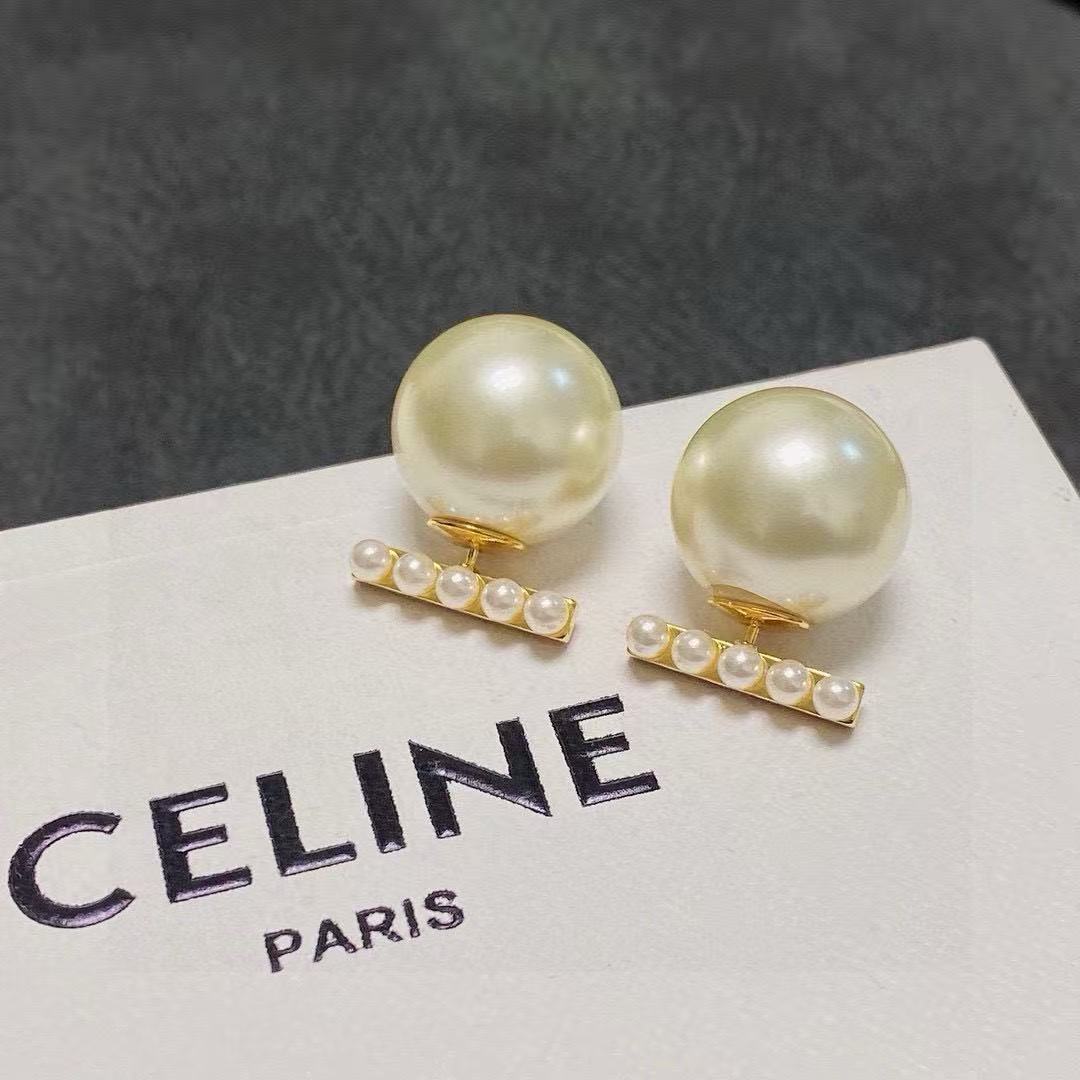 Martin Graham stud earrings in polished metal-tone – detail view