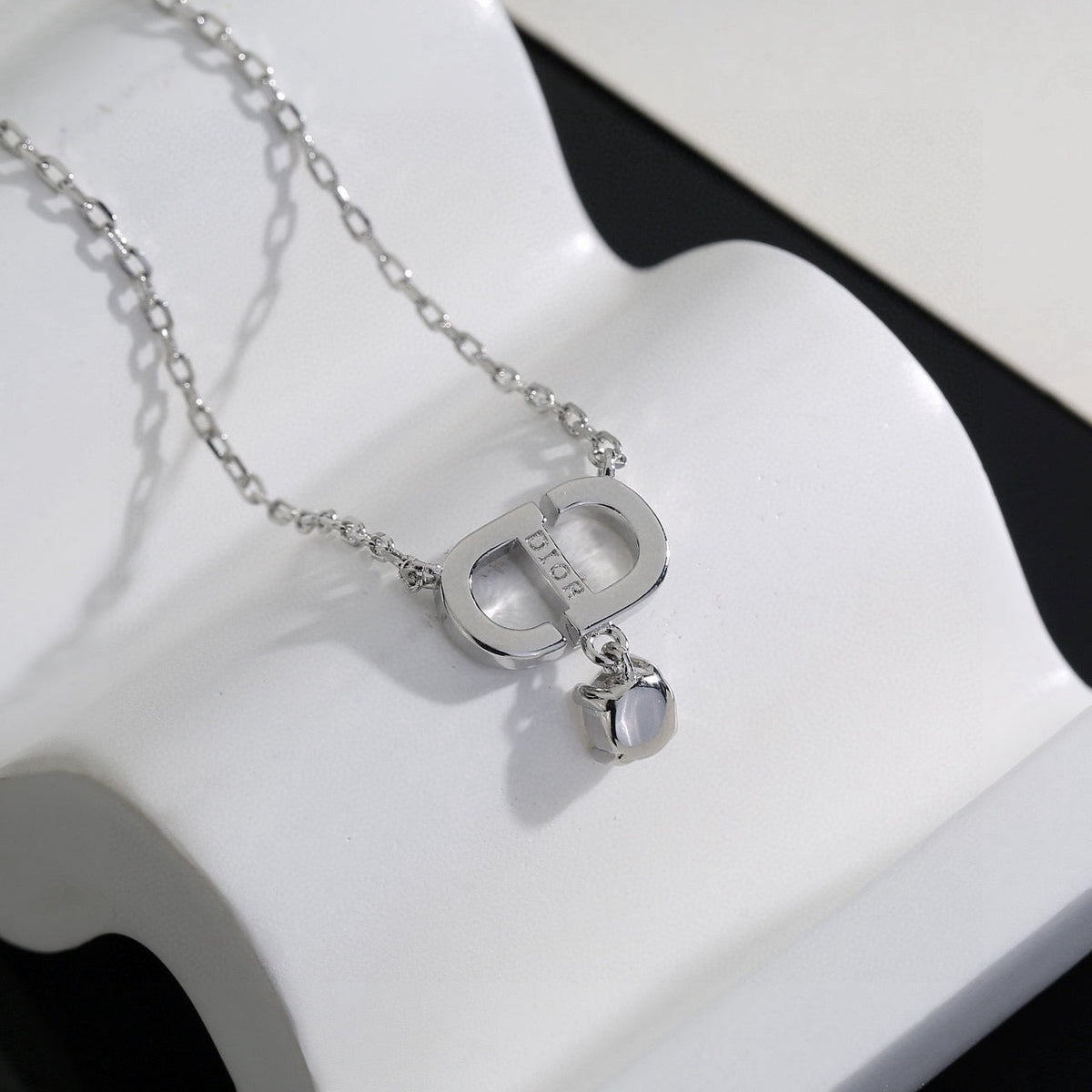 Martin Graham pendant necklace in polished metal-tone – detail view